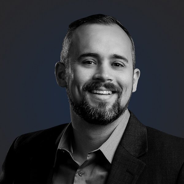 Headshot of Johnny Calhoun from Nisos